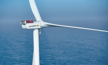 Image of a wind turbine located in the sea.